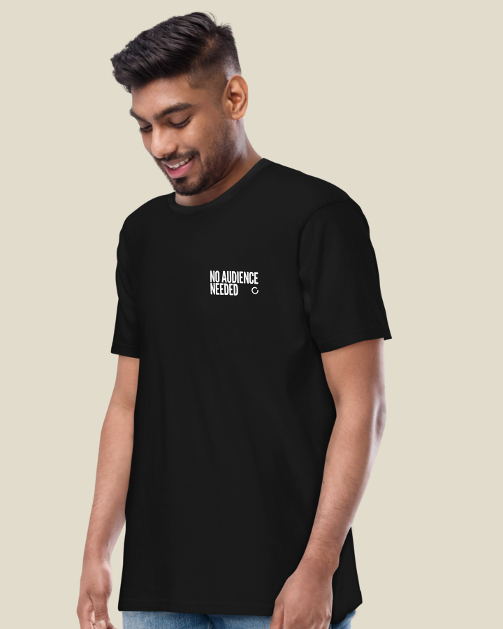 NO AUDIENCE NEEDED shirt, Men's fit, Black. Worn, from the front, with the statement on the left chest.