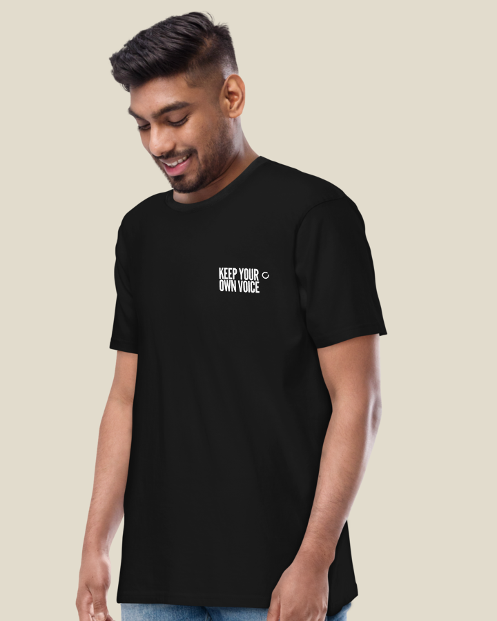 Keep Your Own Voice Premium Tee in Black: the chest lockup on the left chest.