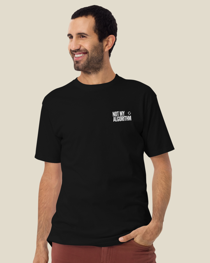 Close view of the NOT MY ALGORITHM statement printed on the left chest of the Men's fit shirt, in Black.